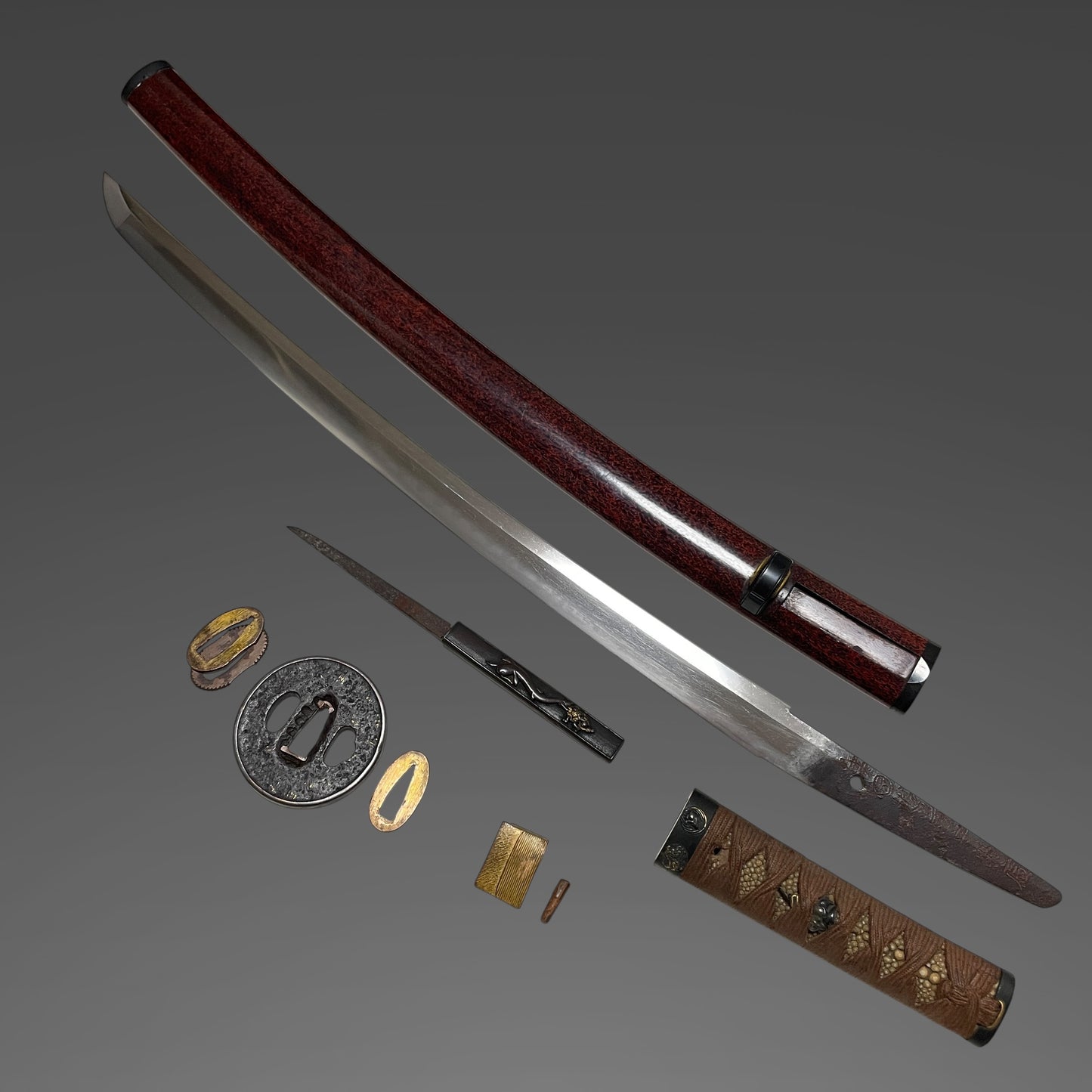 Red Wakizashi Catfish Kozuka,  Tsuda Echizennokami Sukehiro August 1681 signed