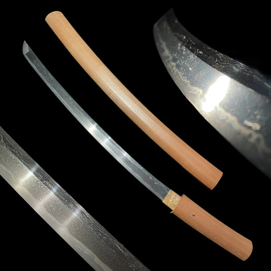 Midareba Short Wakizashi in Shirasaya, Edo period mumei, 395mm (15.55 in.)